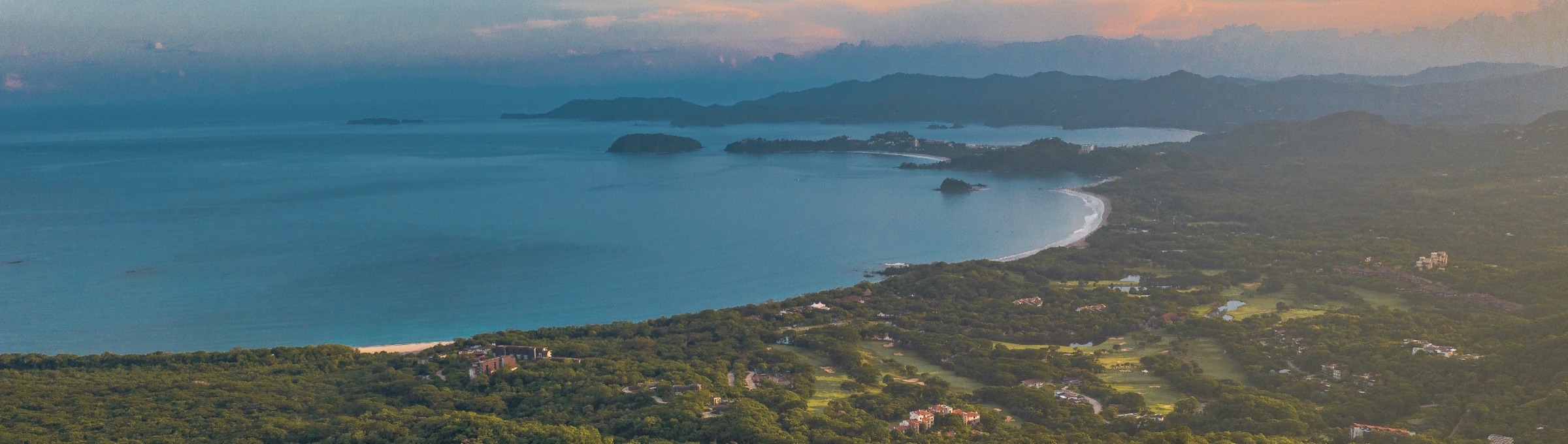 Wide aerial of Reserva Conchal coastline